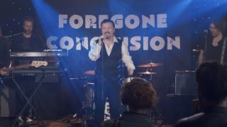 Ricky Gervais performing on stage in David Brent: Life On the Road