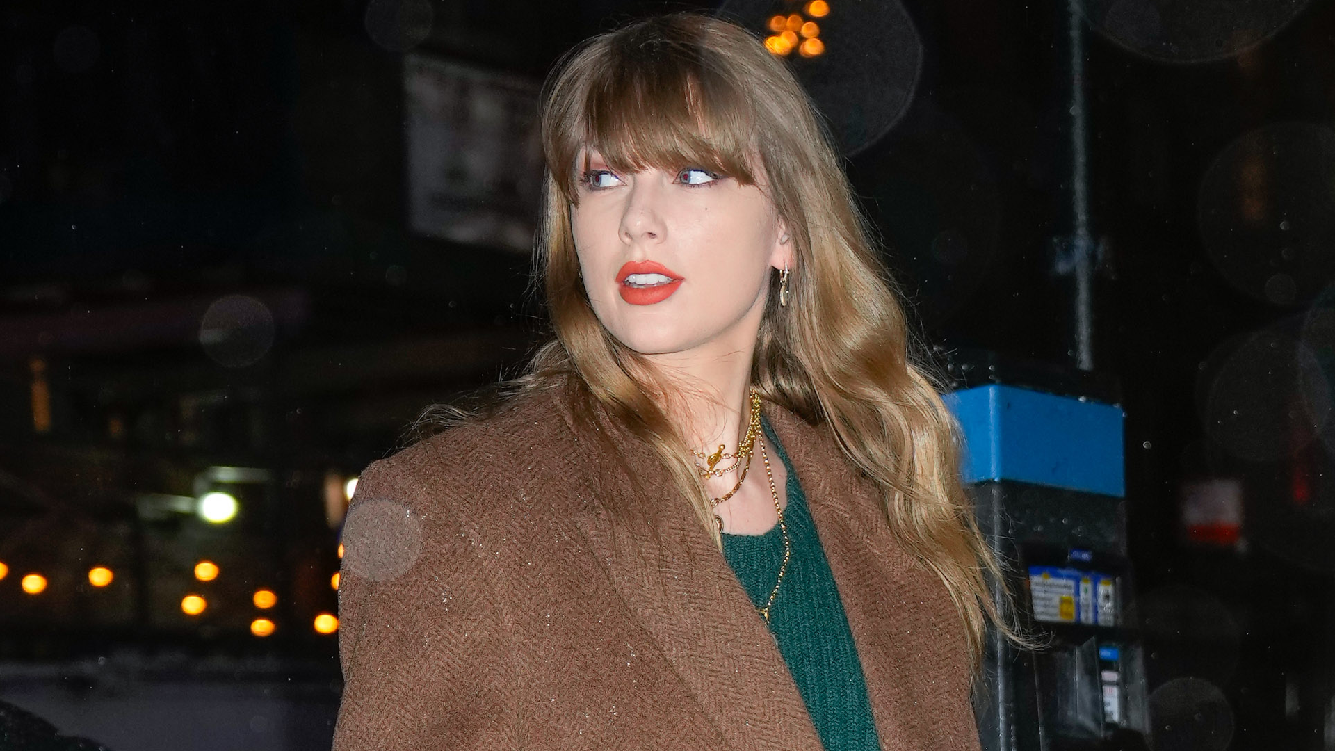 Taylor Swift's Life of a Showgirl song "Opalite" became her 14th Top 100 #1 hit, so she shared videos of her in the studio wearing a pistachio green sweater