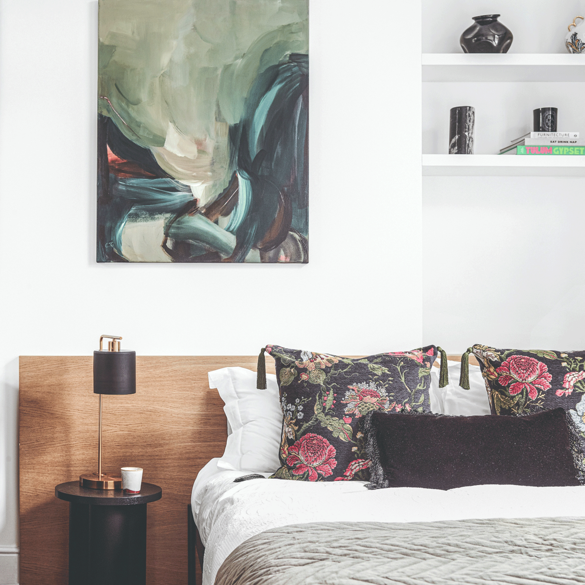 Small bedroom with white wall and wall art