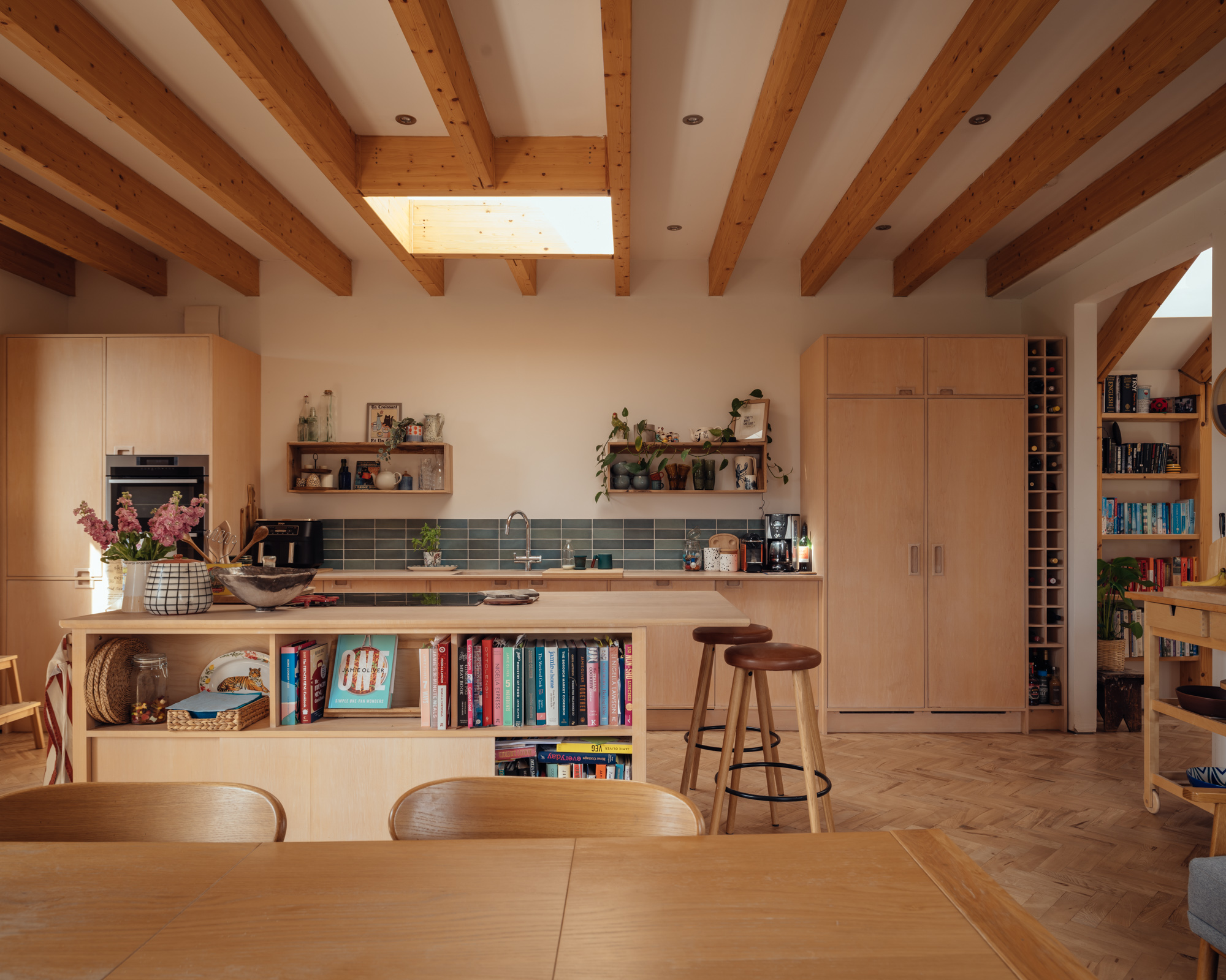 The kitchen and dining room. Ash parquet is used throughout