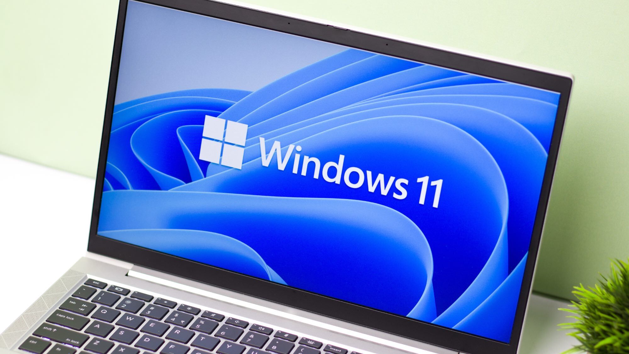 A laptop with the Windows 11 logo