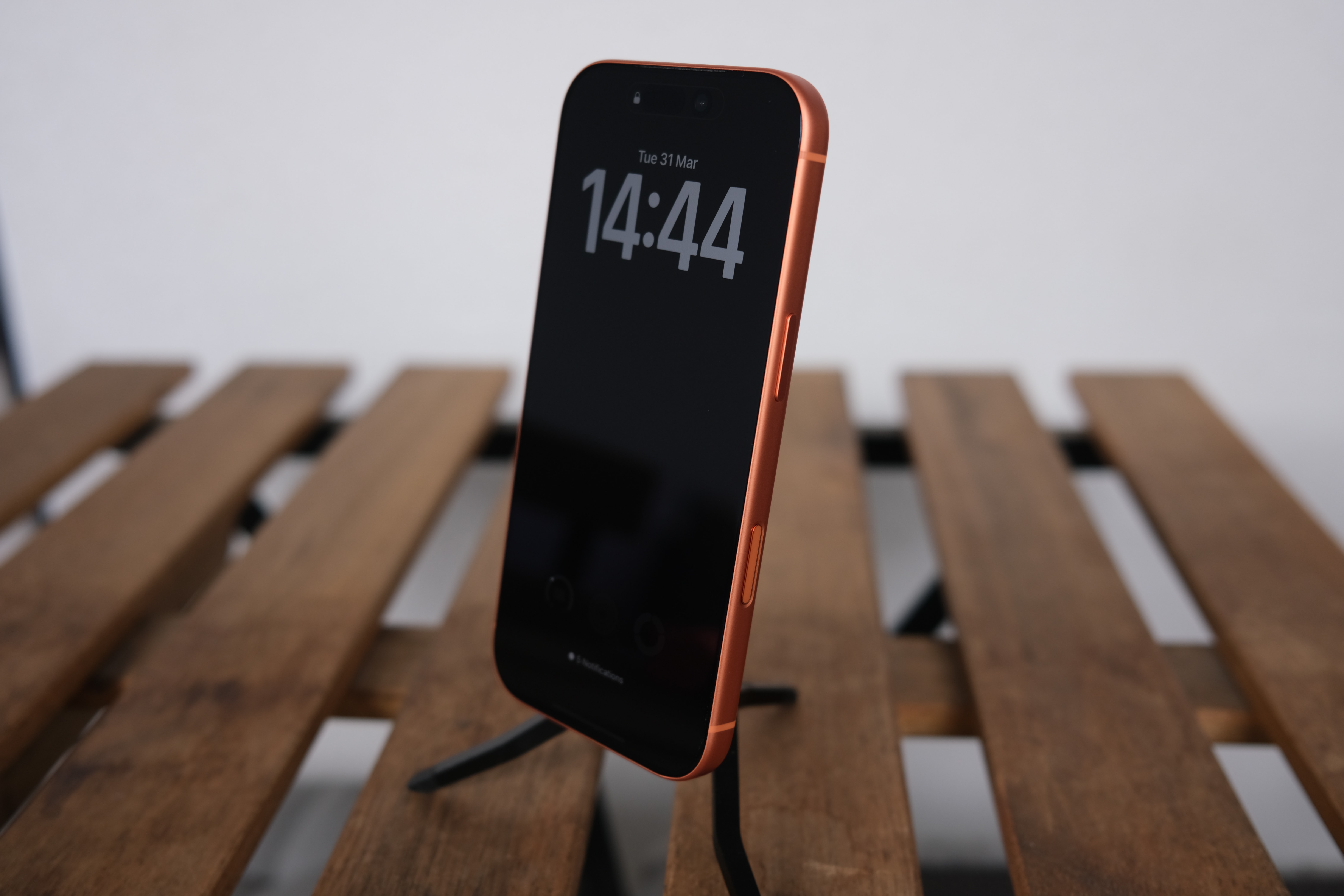 The iPhone 17 Pro resting on a wooden table