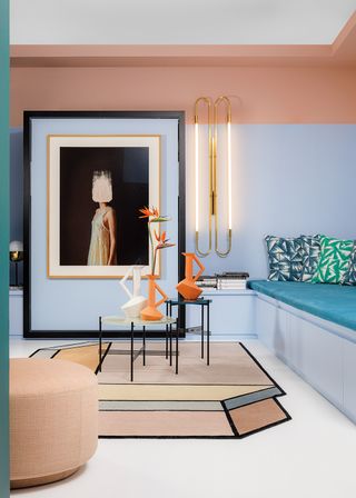 graphic and colorful living room with brass wall lights