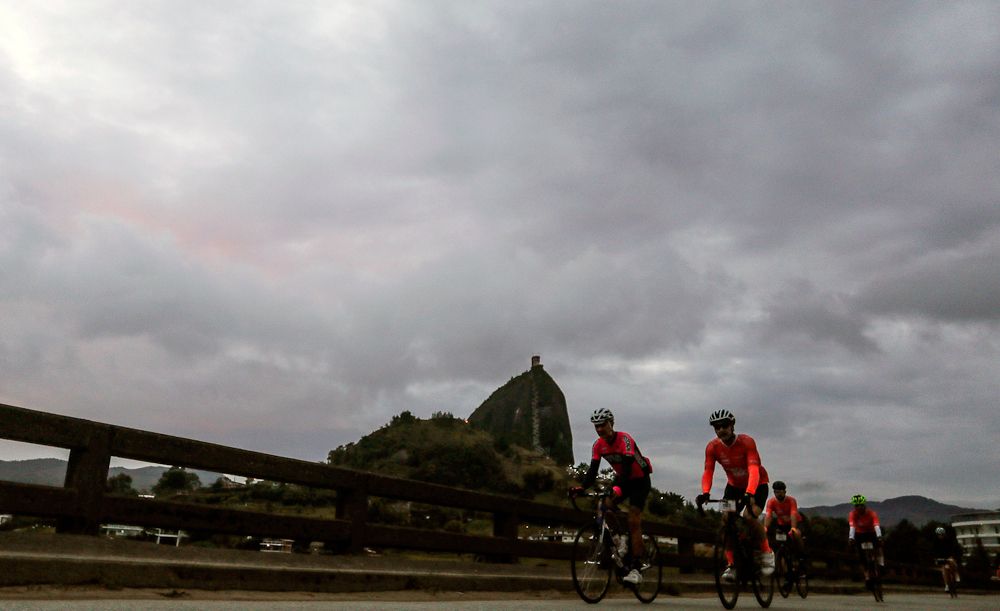 Amateur cyclists ride before the start of the Giro de Rigo in Guatape, Antioquia Department, on November 4, 2018.