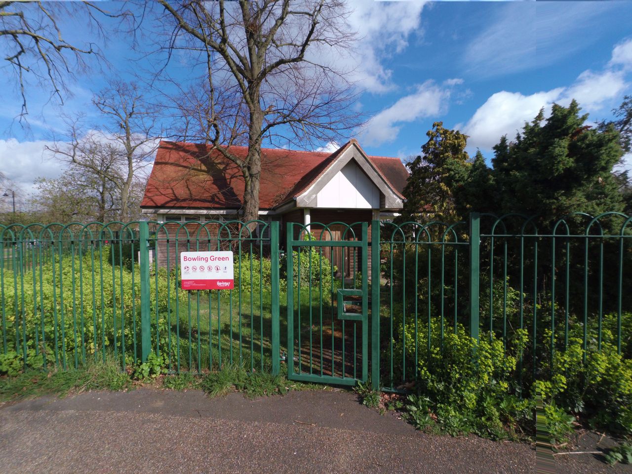 Park wardens hut behind a green fence