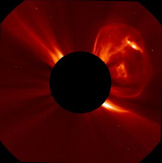 A coronal mass ejection (CME) bursting off the left side of the sun. This image was captured by the SOlar and Heliospheric Observatory (SOHO) at 6:05 PM ET on September 21, 2011.