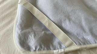 Elastic strap on a Dunelm Teddy Electric Blanket