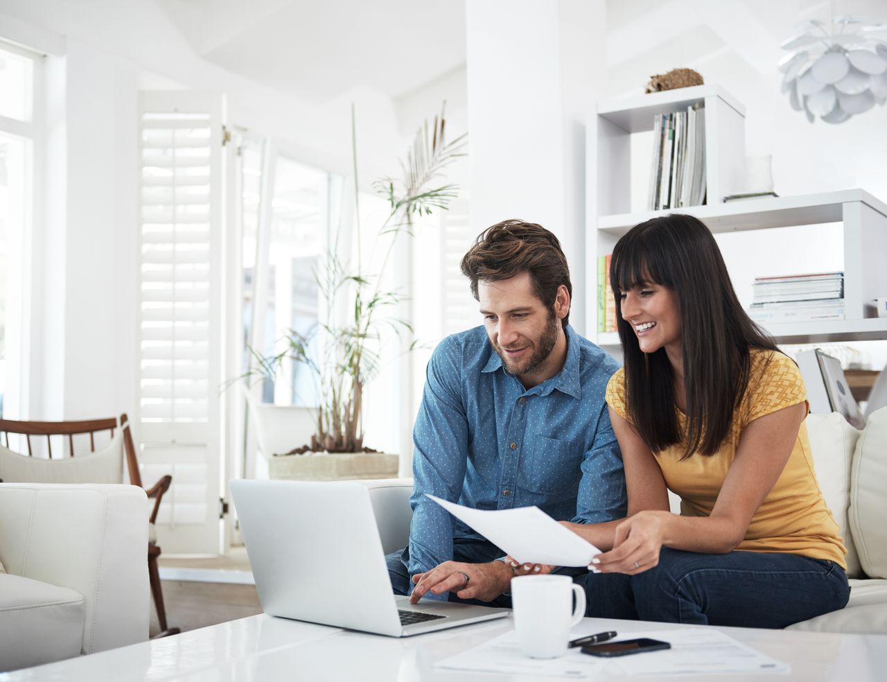 Cropped shot of a couple using a laptop at homehttp://195.154.178.81/DATA/i_collage/pu/shoots/806038.jpg