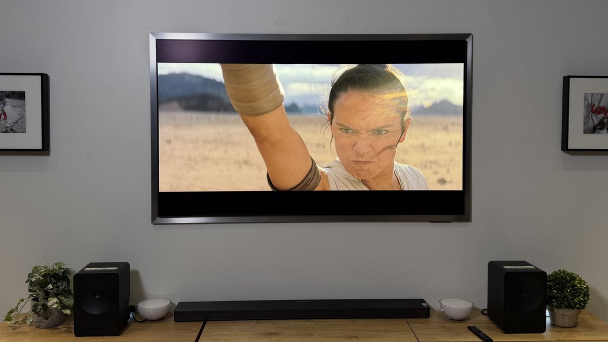 The wall-mounted Samsung S95H OLED displaying a scene from "Star Wars: The Rise of Skywalker"