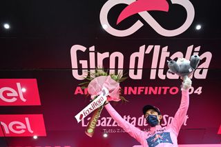 VALLE SPLUGA ALPE MOTTA ITALY MAY 29 Egan Arley Bernal Gomez of Colombia and Team INEOS Grenadiers Pink Leader Jersey celebrates at podium during the 104th Giro dItalia 2021 Stage 20 a 164km stage from Verbania to Valle Spluga Alpe Motta 1727m Mask Covid safety measures Mascot UCIworldtour girodiitalia Giro on May 29 2021 in Valle Spluga Alpe Motta Italy Photo by Stuart FranklinGetty Images