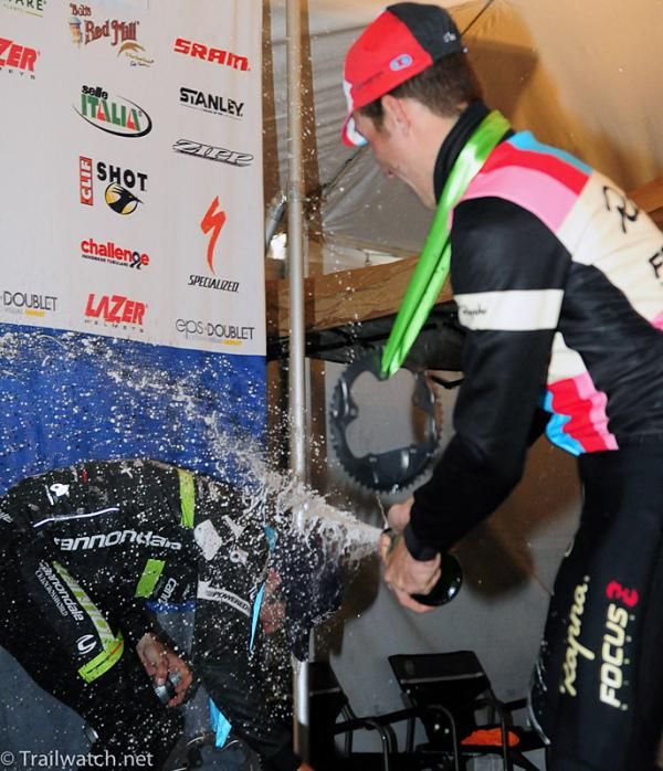 Jeremy Powers sprays his former teammate Tim Johnson with champagne