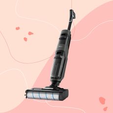 Tefal X-CLEAN 4 vacuum mop on a pink background