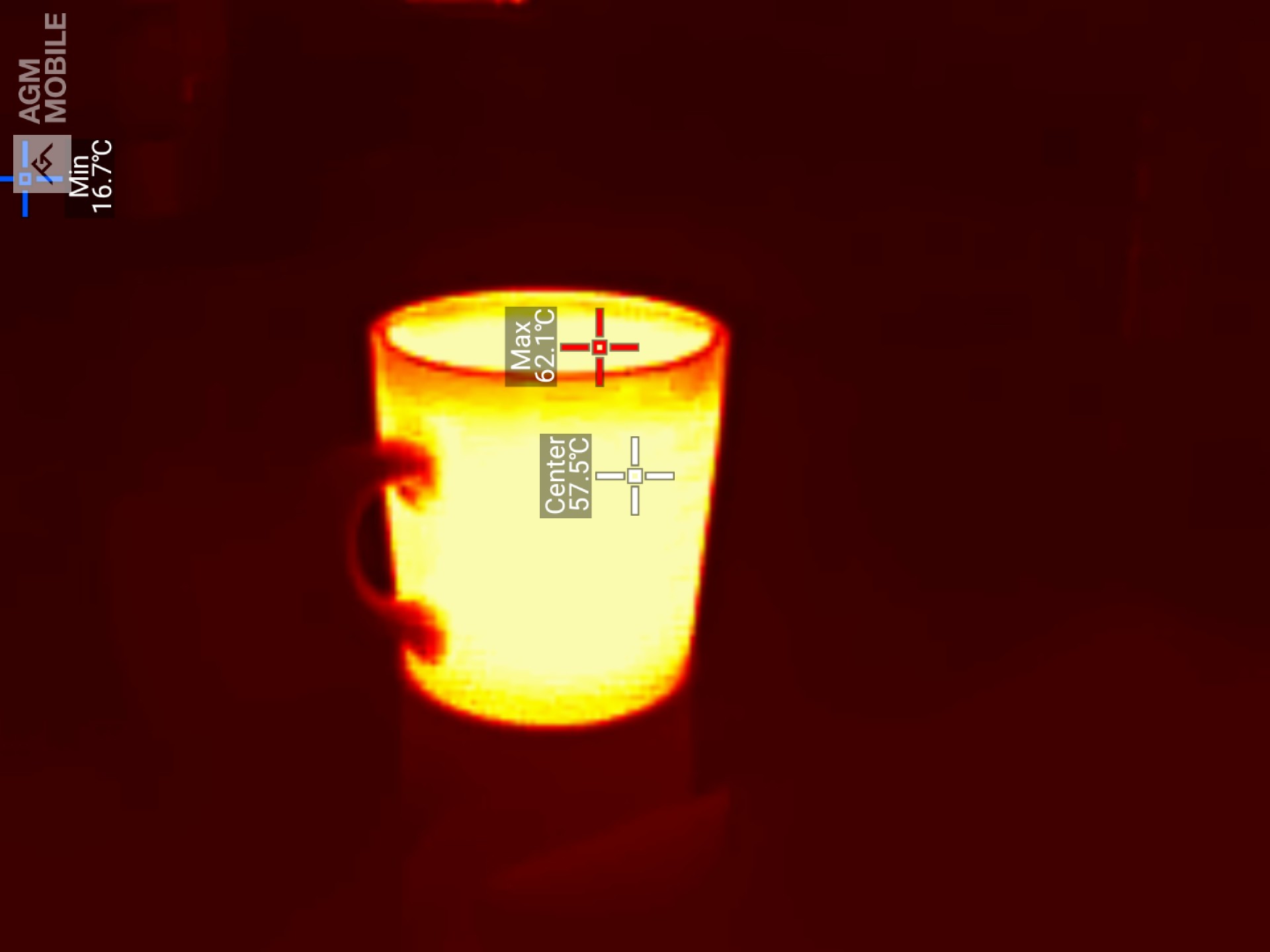 A thermal image of a hot beverage in a mug being held by a hand, showing a maximum temperature of 62.1&deg;C at the liquid's surface.