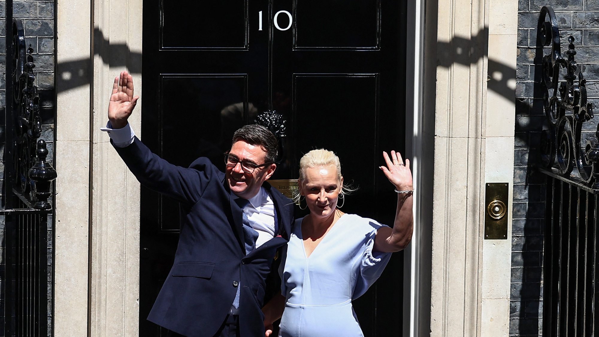 Andy Burnham and wife Marie-France van Heel pictured by No 10 Downing Street entrance