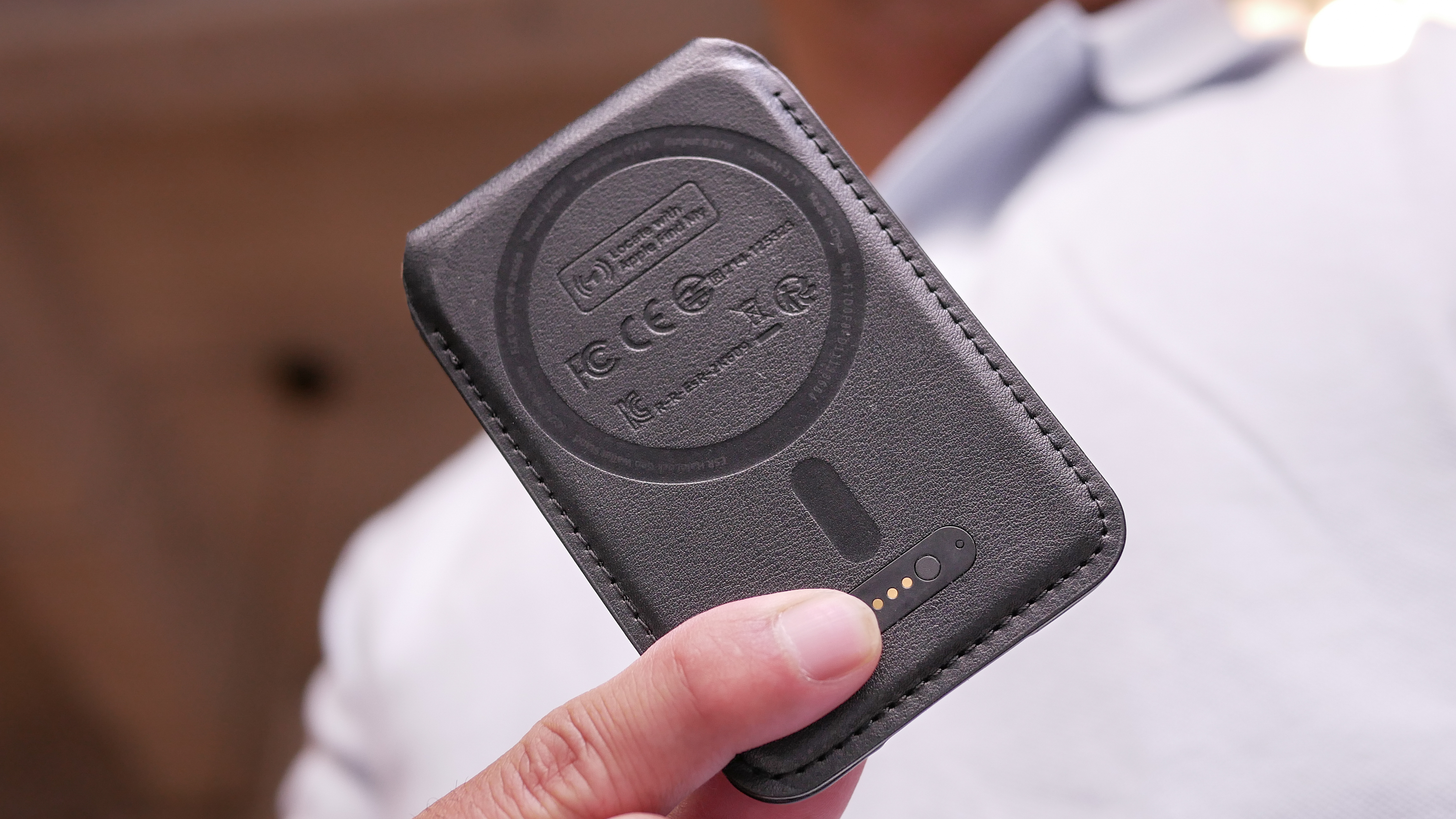 Closeup of charging port on ESR MagSafe Wallet with Find My.