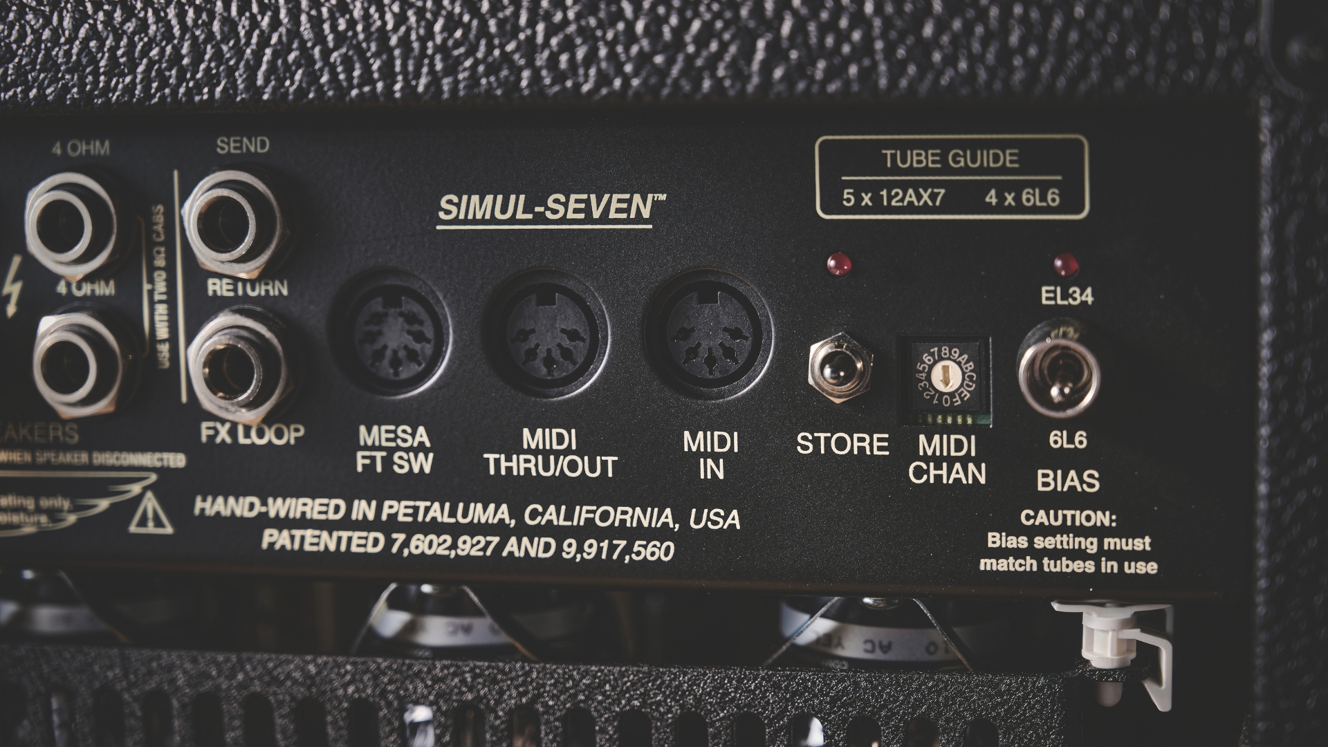The back panel of a Mesa/Boogie tube amp with MIDI connections