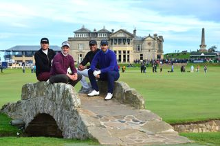 Finau, Redknapp and Donald sit on a bridge