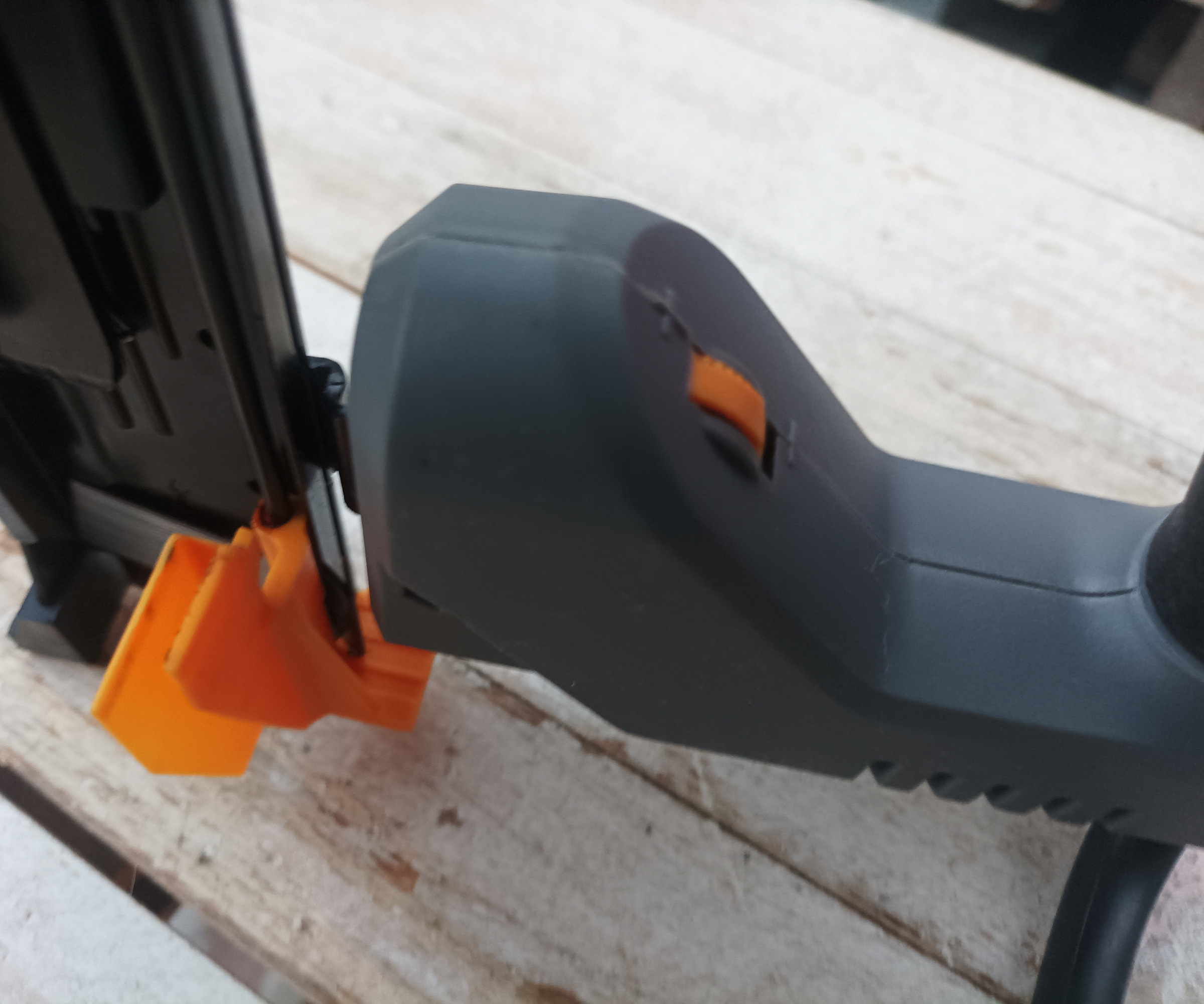 Close up of impact control slider button on Titan nail gun