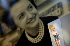 An image of Ruth Handler behind an original Barbie doll