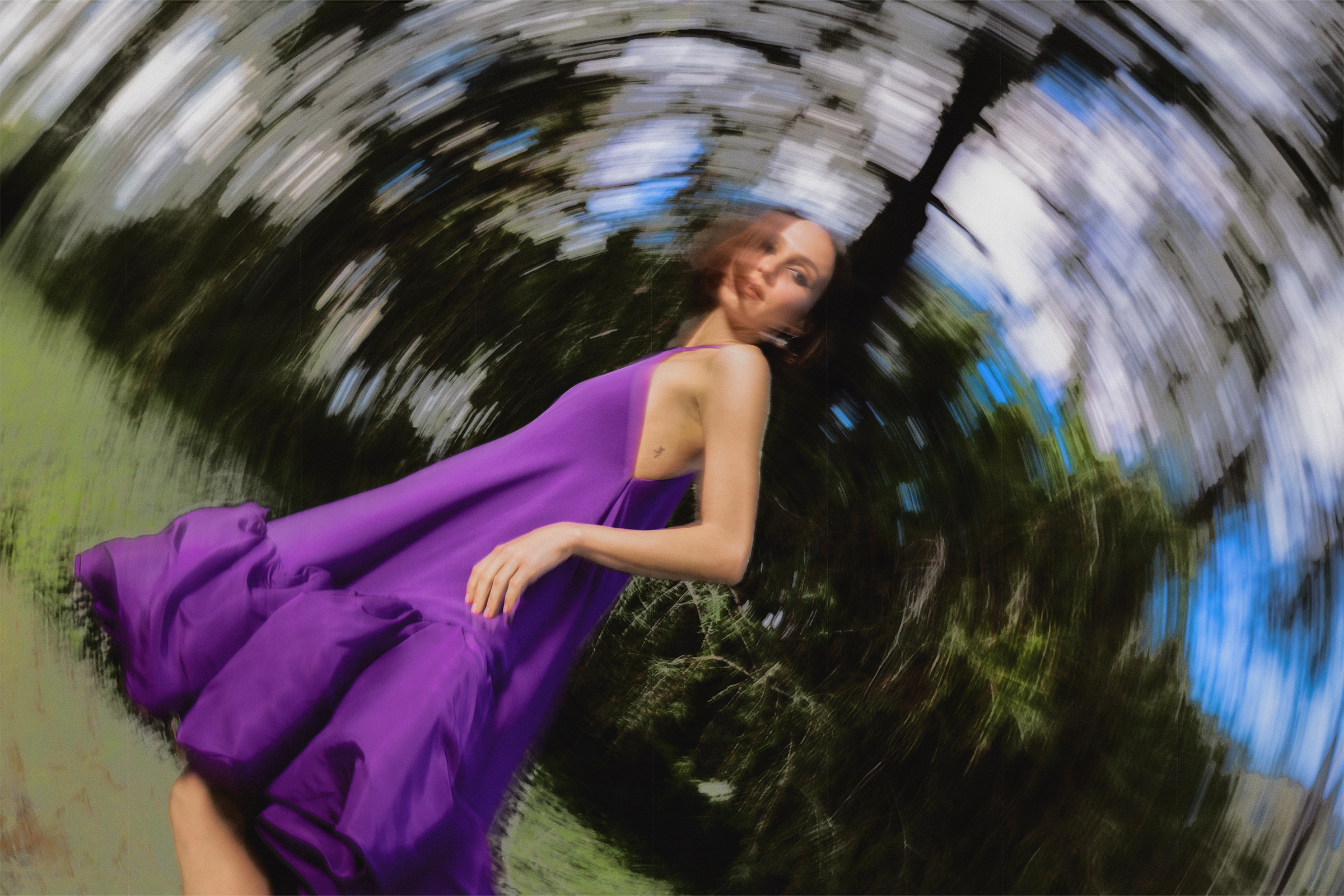 Maude Apatow photographed by Dana Trippe for Who What Wear wearing a purple Balenciaga dress. The image captures Apatow in motion.