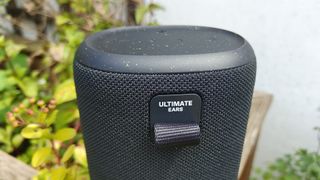 Ultimate Ears Everboom wireless speaker close up on end of unit and logo