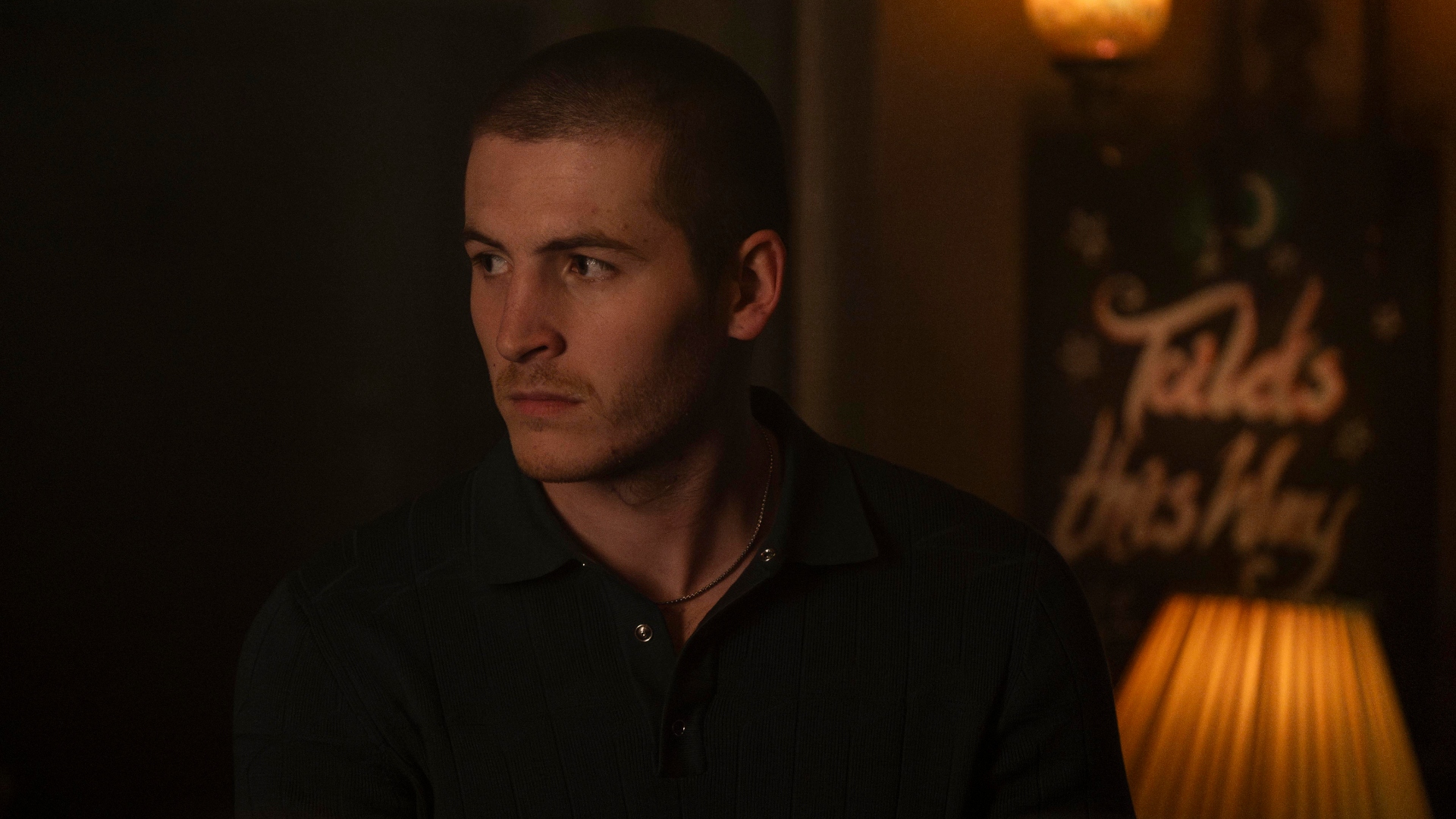 Liam stands in the pub in Code of Silence