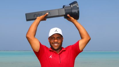 Harold Varner III with the LIV Golf trophy before the 2022 tournament in Jeddah