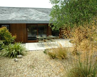 garden design with pebbles and ornamental grasses