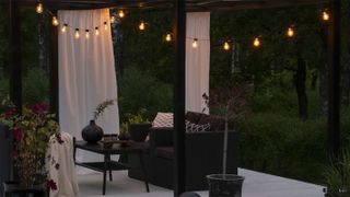 deck with pergola and fairy lights