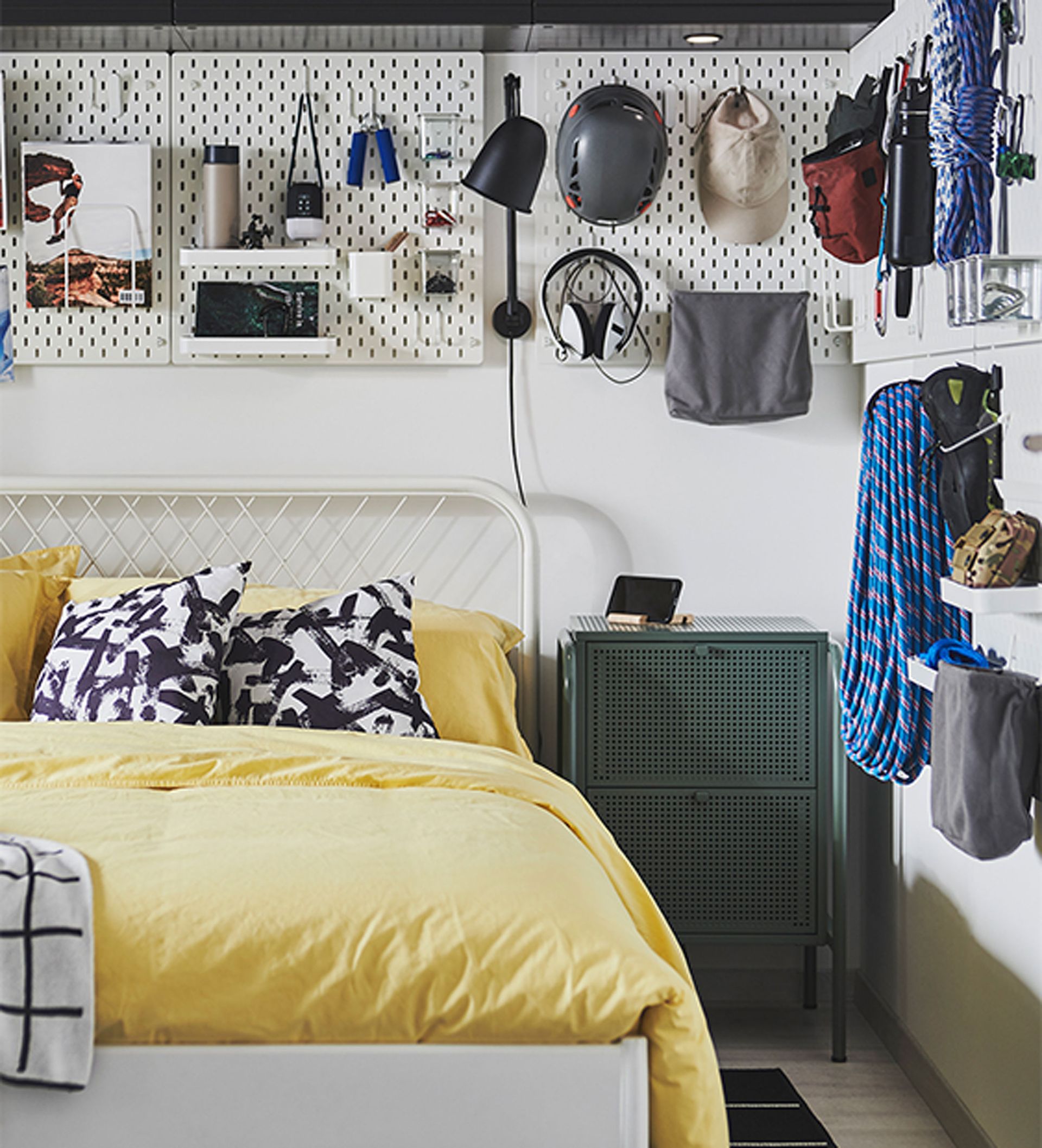 Teenage bedroom ideas with wall storage and yellow bedlinen