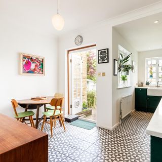 kitchen area with wooden table and chairs