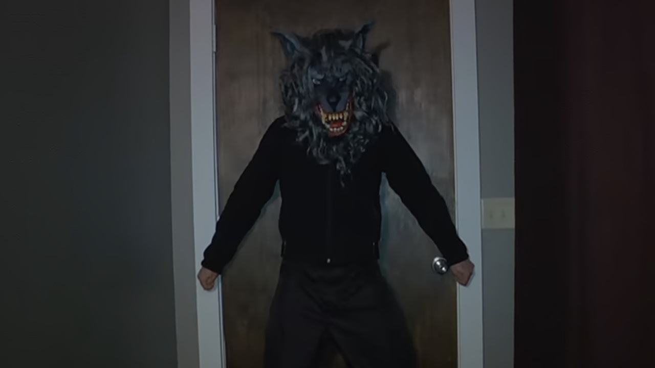 Mark Duplass in the Peachfuzz mask guarding the door in Creep