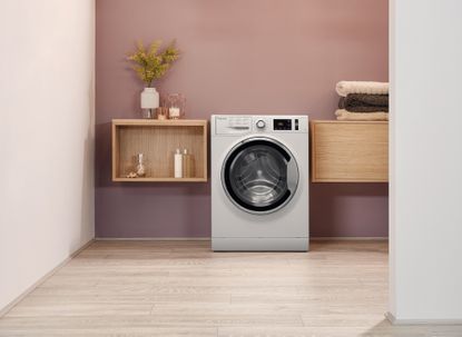 Hotpoint ActiveCare NM111064WCAUKN washing machine in utility room