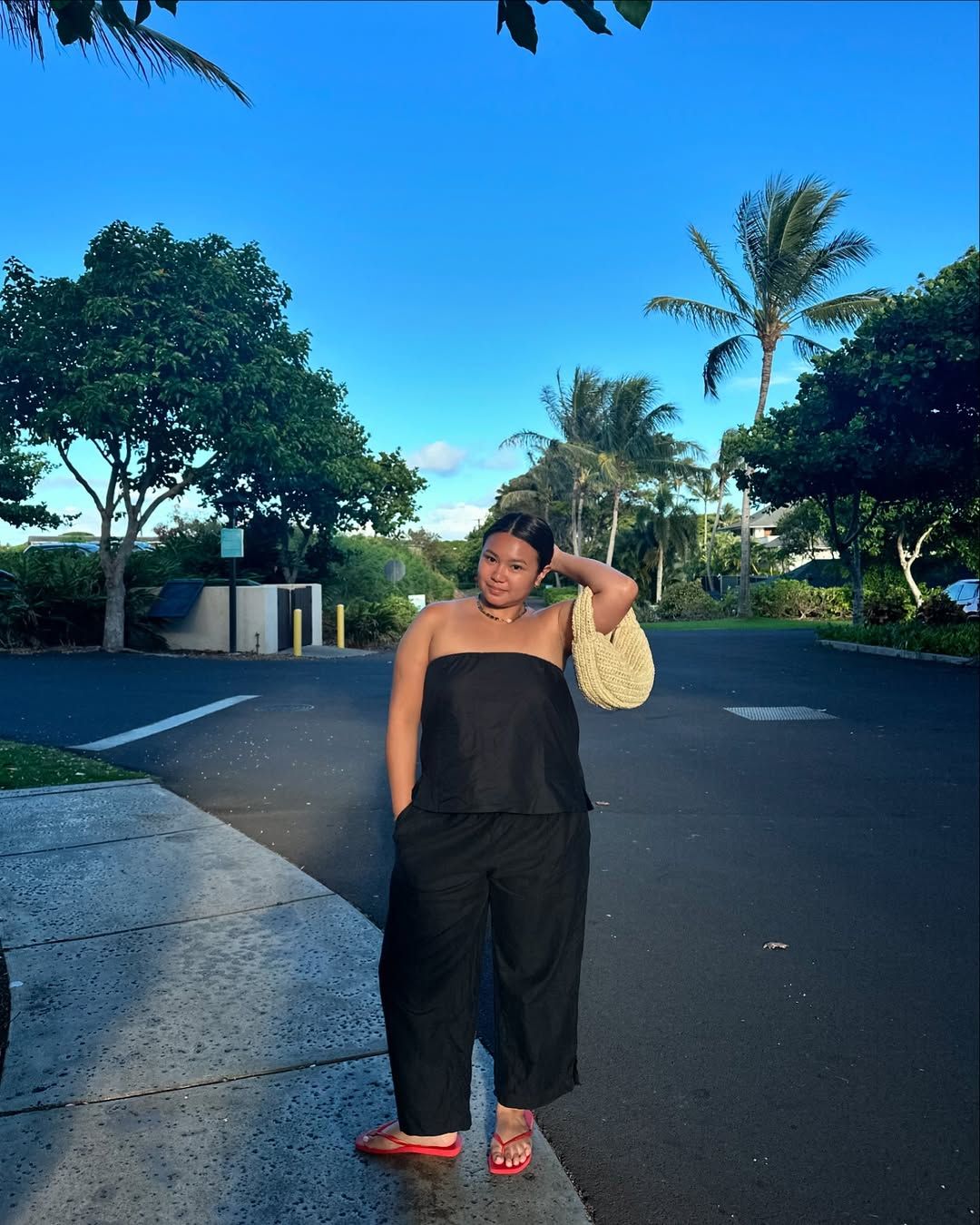 Marina in black monochrome outfit and red jelly sandals