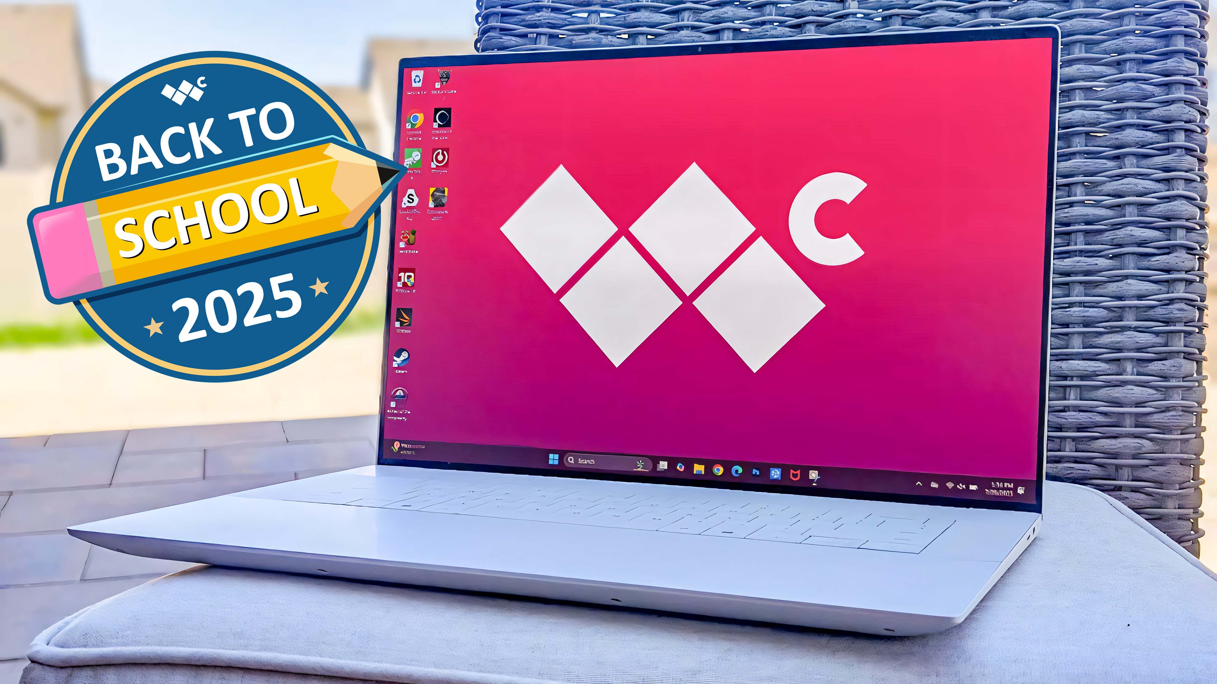 The Dell 16 Premium outside on a cushion with a patio backdrop. The Windows Central logo is on the laptop's background screen. A graphic on the left of the screen says, "Back to School 2025."