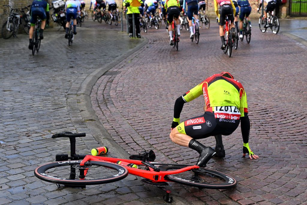 KOKSIJDE BELGIUM MARCH 15 Alexander Salby of Denmark and Team Bingoal WB after being involved in a crash during the 22nd Bredene Koksijde Classic 2024 a 2012km one day race from Bredene to Koksijde on March 15 2024 in Koksijde Belgium Photo by Luc ClaessenGetty Images