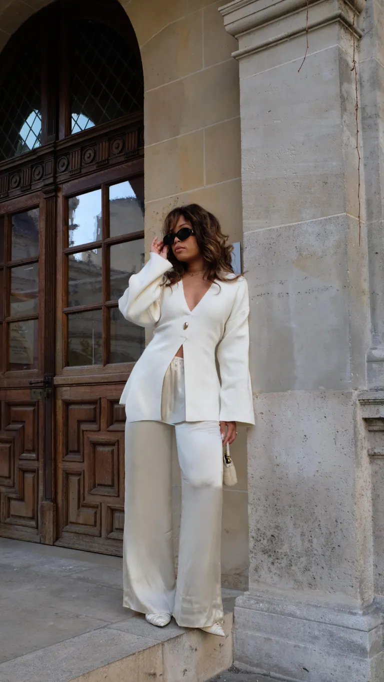 Woman in satin pants and cardigan