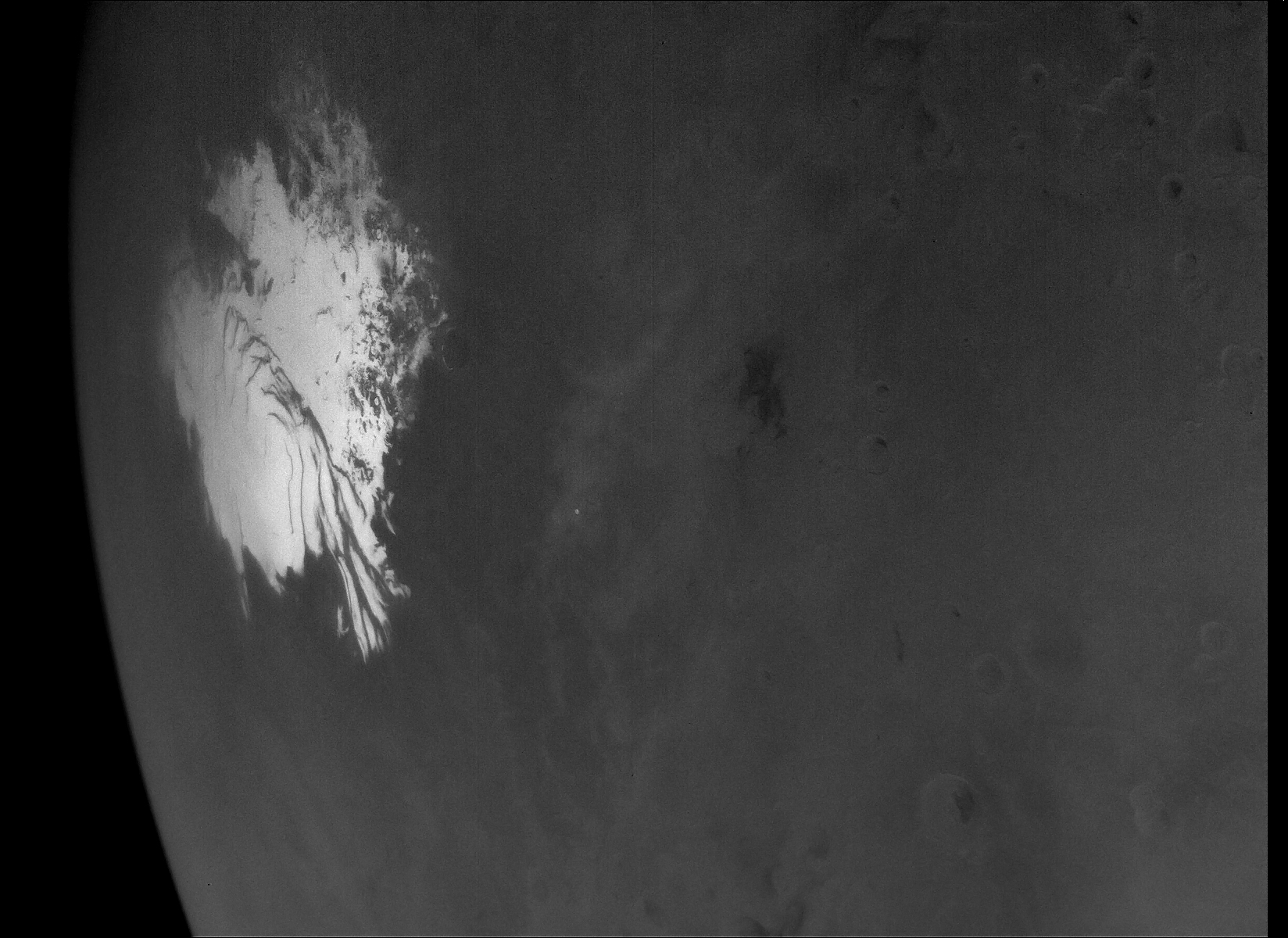 A black-and-white image of Mars captured by NASA's Psyche spacecraft is the largest resolution shot yet of the planet's ice cap