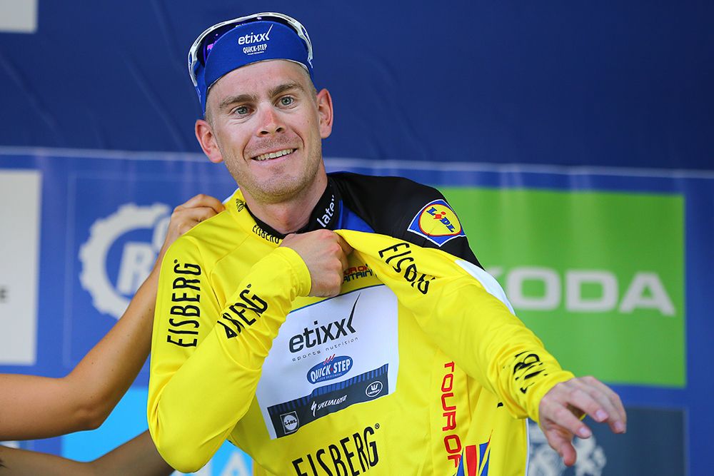 Julien Vermote puts on the yellow jersey after stage 5 at the Tour of Britain.