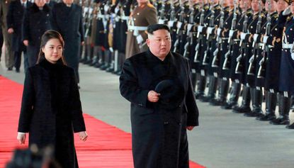 Kim Jong-un and his wife Ri Sol-ju have arrived in China for talks with Xi Jinping