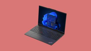 Lenovo ThinkPad E16 laptop against a red background