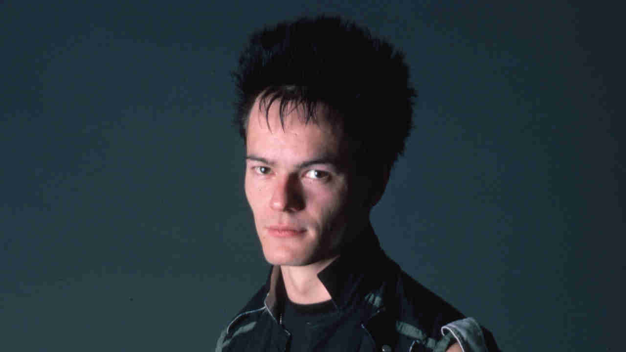 The Clash guitarist Vince White posing for a photograph in 1984