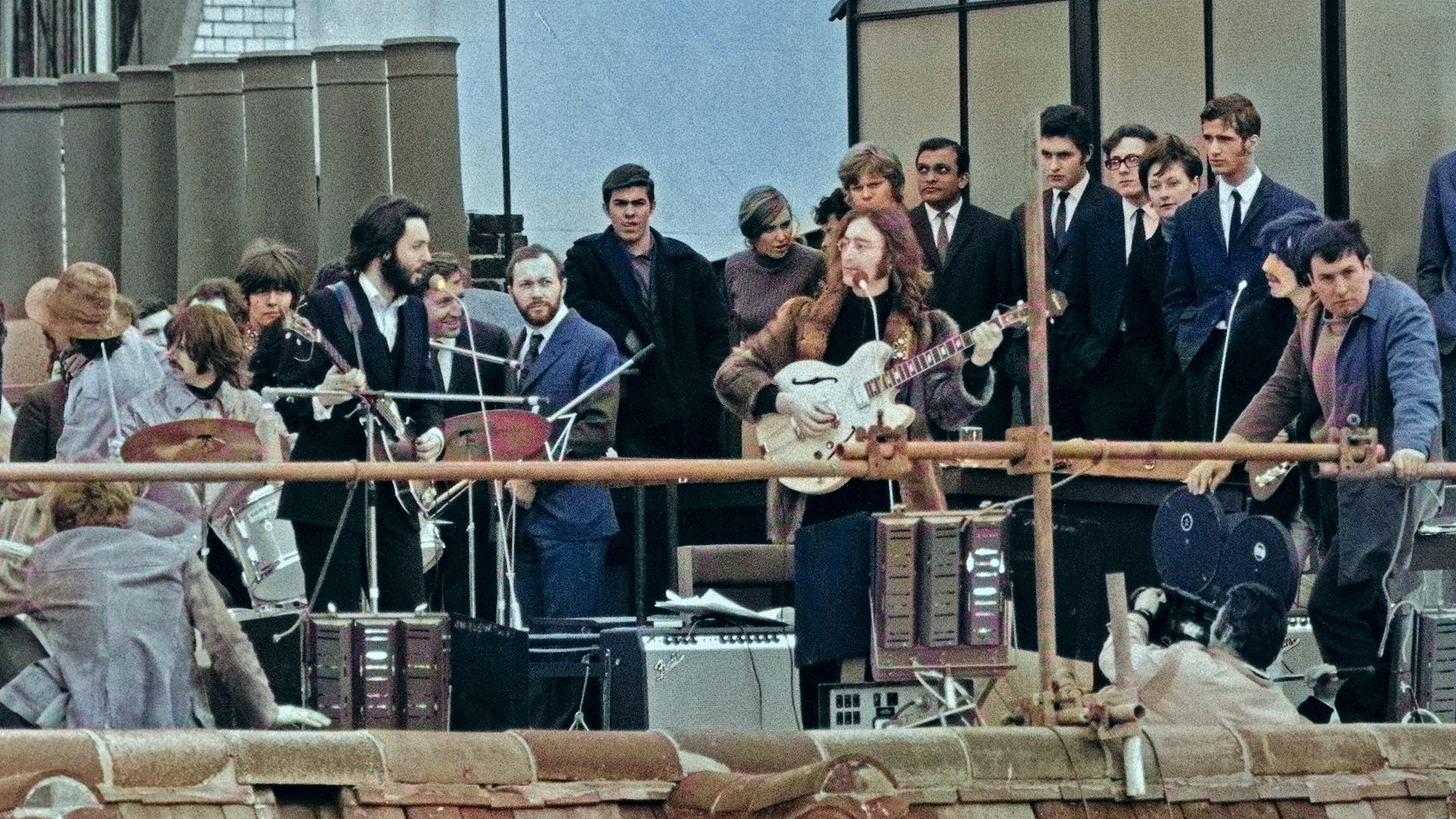 The Beatles perform a rooftop concert at Apple Headquarters, 3 Saville Row London on 30th January 1969. The performance was a part of filming for a documentary of the band rehearsing and recording the album Let It Be. Left to right: Ringo Starr, Paul McCartney, John Lennon and George Harrison.Contributor: