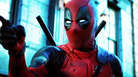 Ryan Reynolds as Wade Wilson, pointing off-screen in Deadpool 2