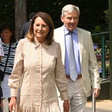 Carole and Michael Middleton arriving at Wimbledon in a tan suit and striped brown dress