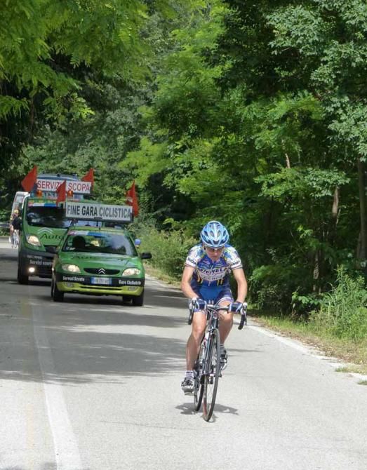 The final rider nears the summit