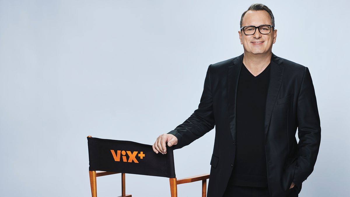 Pierluigi Gazzolo standing next to a chair saying ViX Plus.