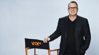 Pierluigi Gazzolo standing next to a chair saying ViX Plus.