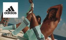 Adidas Logo placed over an image of people wearing adidas products such as socks and shoes