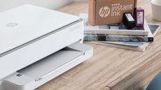 HP printer with HP instant ink package beside